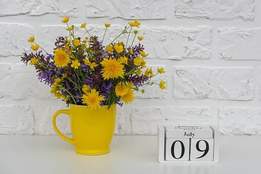 flowers next to july 9 blocks